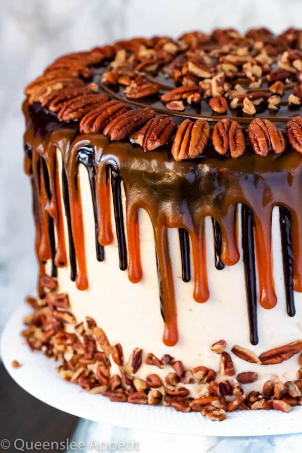 This Turtle Chocolate Layer Cake starts with rich, decadent and moist chocolate cake layers that are filled with a caramel pecan sauce and covered in a smooth caramel frosting, then finished off with a caramel and ganache drip and chopped pecans! 