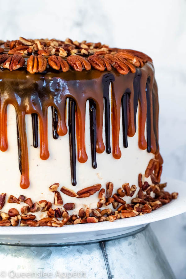 This Turtle Chocolate Layer Cake starts with rich, decadent and moist chocolate cake layers that are filled with a caramel pecan sauce and covered in a smooth caramel frosting, then finished off with a caramel and ganache drip and chopped pecans! 