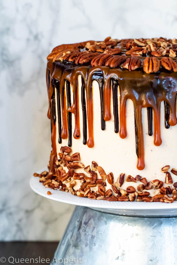 This Turtle Chocolate Layer Cake starts with rich, decadent and moist chocolate cake layers that are filled with a caramel pecan sauce and covered in a smooth caramel frosting, then finished off with a caramel and ganache drip and chopped pecans! 