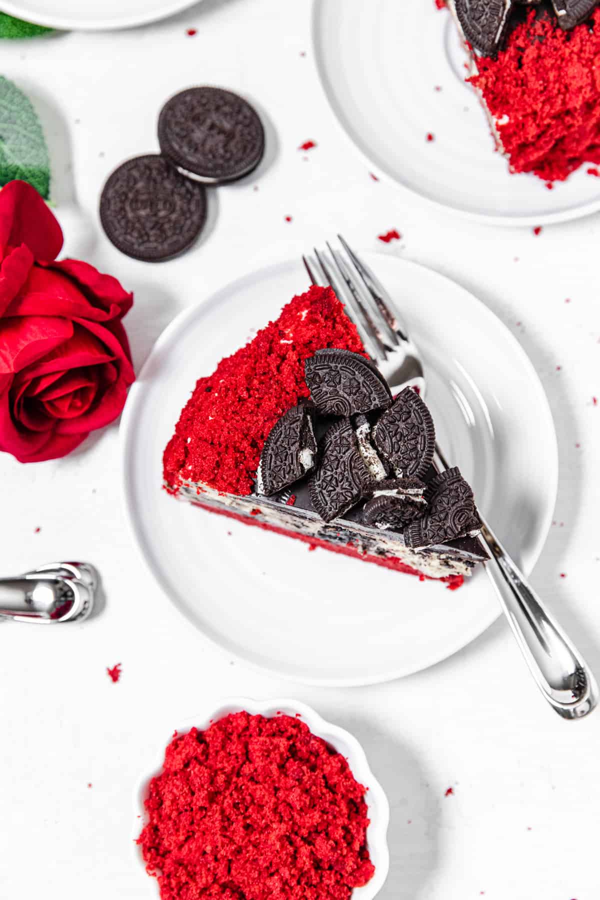 top view of cheesecake slice on a white plate with a fork