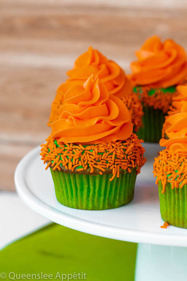 These Leprechaun Hat Cupcakes are super adorable and fun to make! A moist green vanilla cupcake stuffed with gold sprinkles, topped with a fluffy green and orange vanilla frosting and a cute little leprechaun hat sitting on top! This is the ultimate St. Patrick’s Day treat!