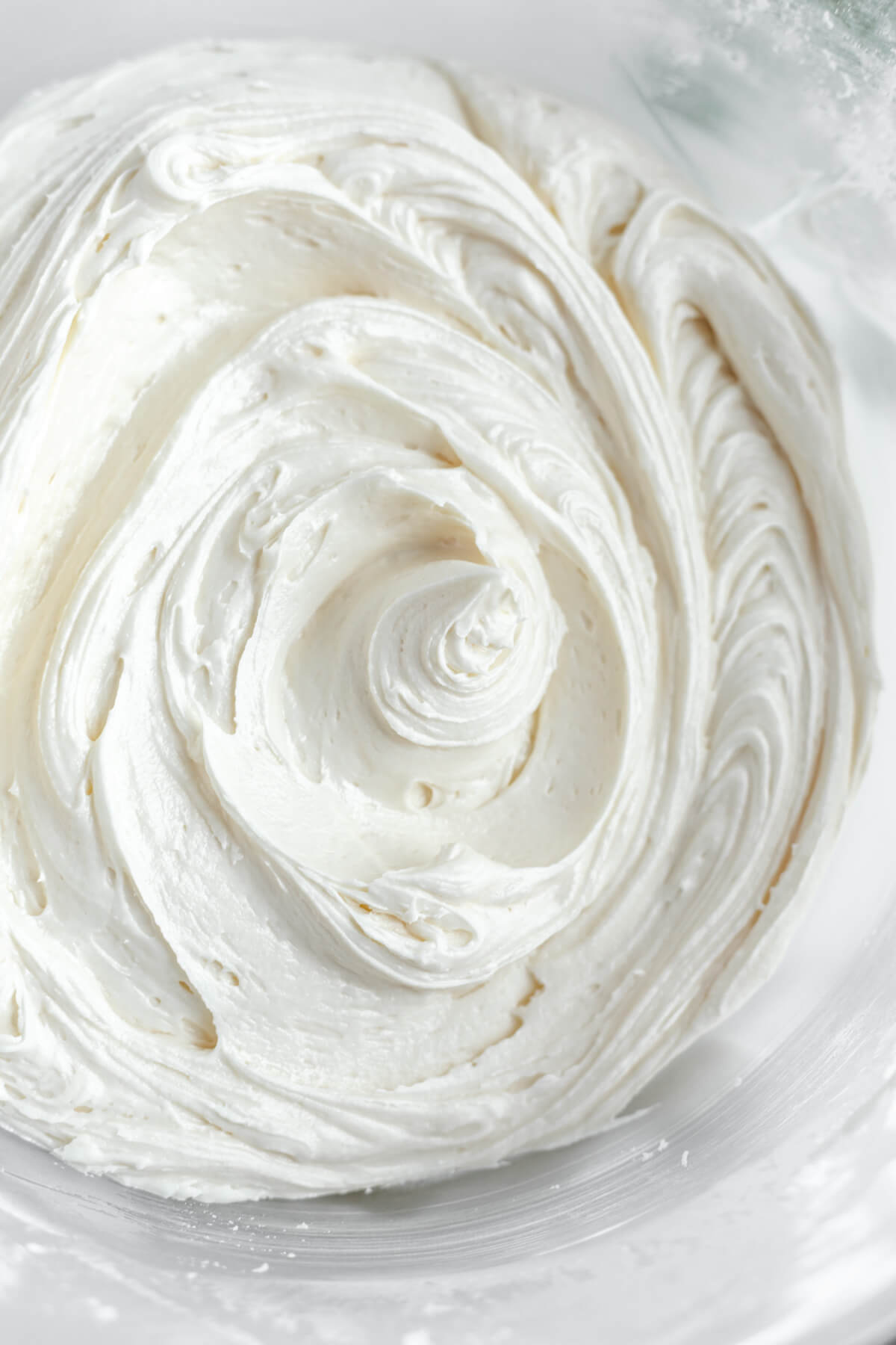 cream cheese frosting in a glass bowl