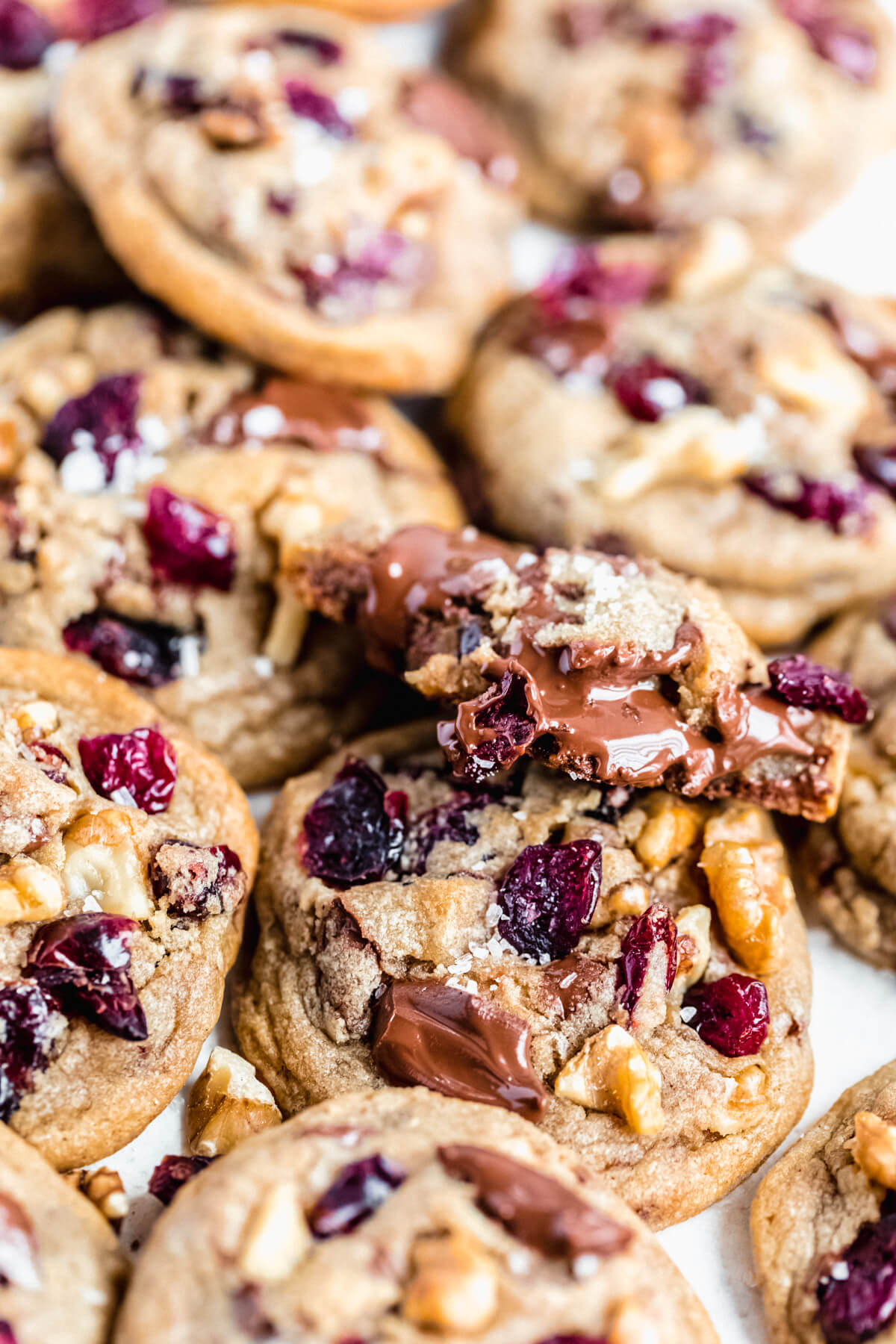 half eaten cookie on top of many other cookies