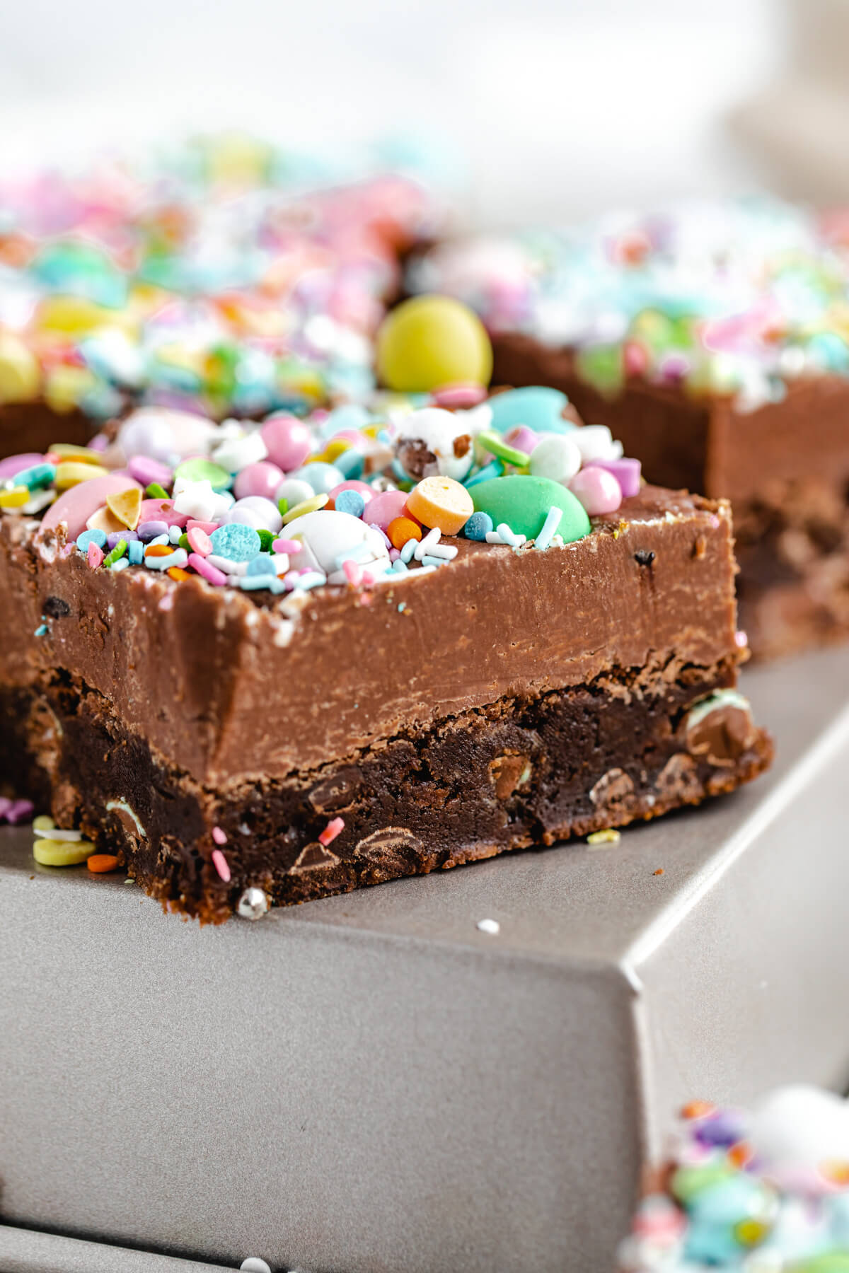 close up of fudge brownie on a square cake pan