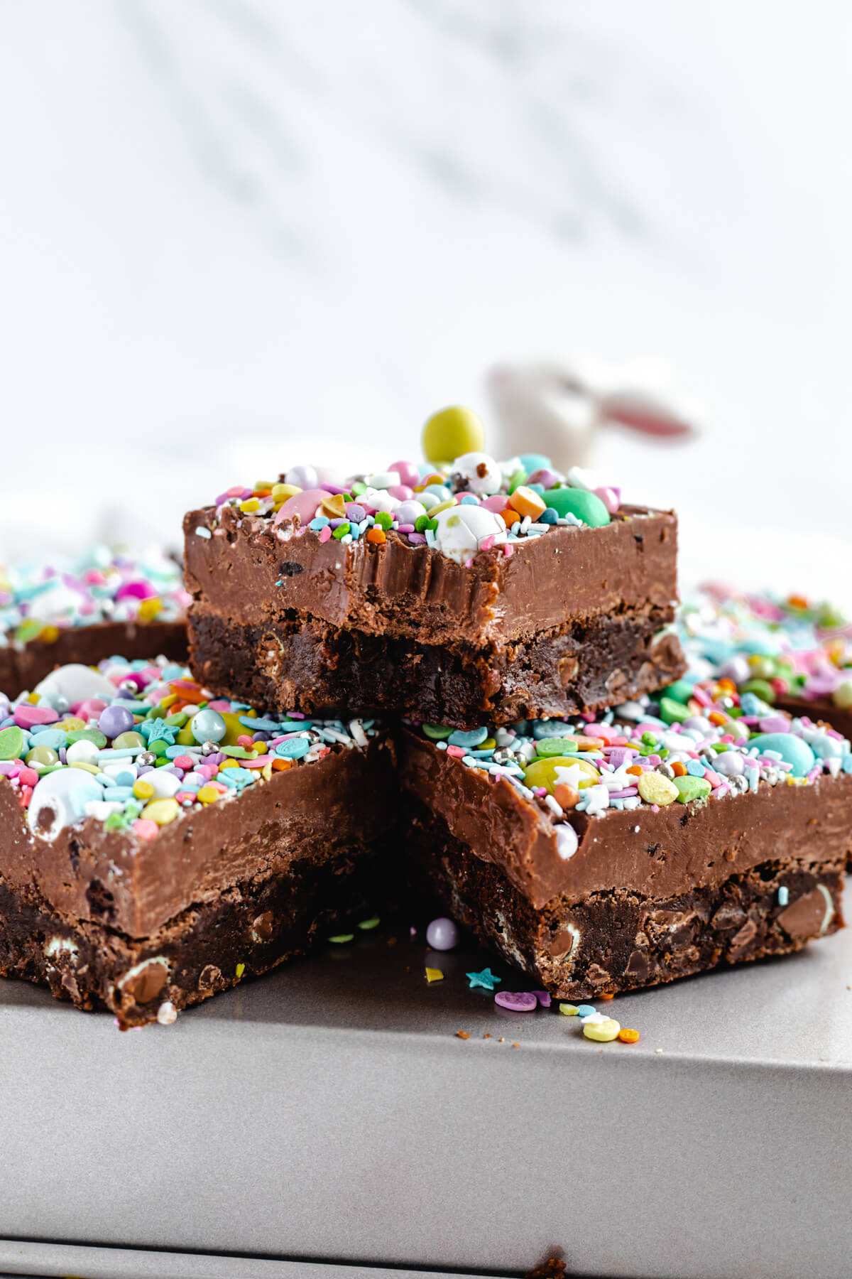 brownie with bite taken out stacked on top of two other brownies