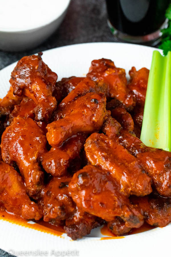 Crispy Baked Buffalo Chicken Wings with celery sticks on the side