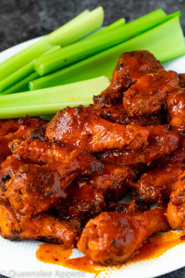 Crispy Baked Buffalo Chicken Wings with celery sticks on the side