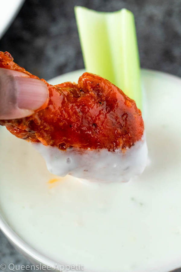 Crispy Baked Buffalo Chicken Wings dipped in blue cheese dressing