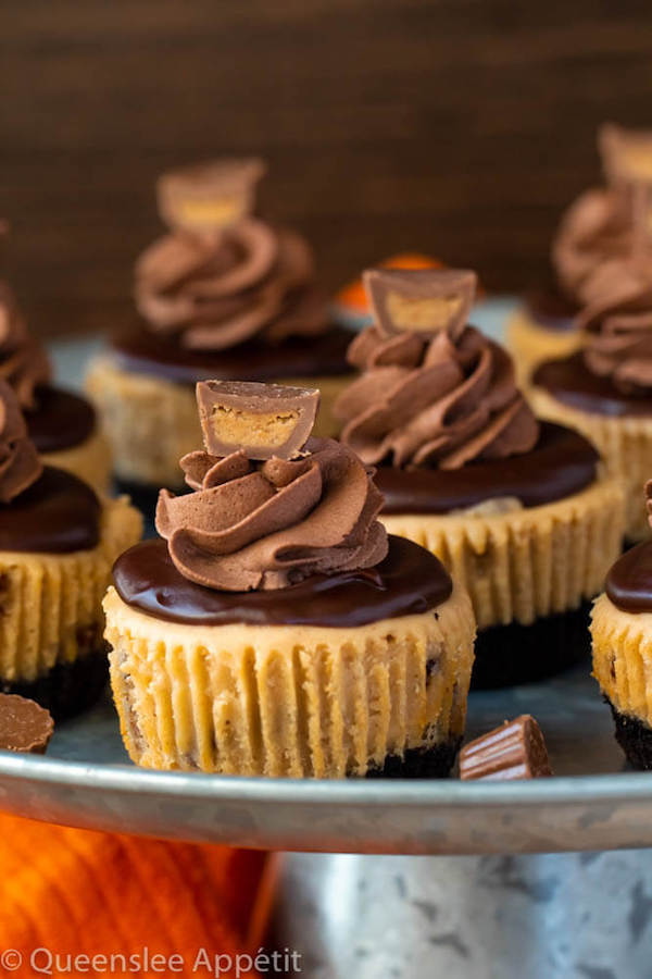 Mini Reese's Peanut Butter Cheesecakes on a cake stand