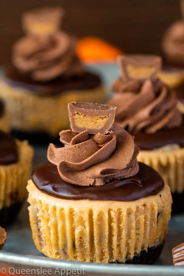 Mini Reese's Peanut Butter Cheesecakes on a cake stand