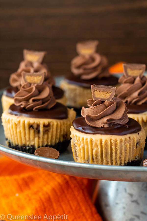 Mini Reese's Peanut Butter Cheesecakes on a cake stand