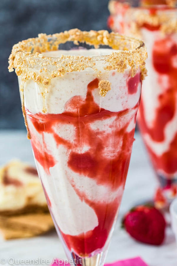 Strawberry Cheesecake Milkshake with Strawberry Sauce Glass Drizzle and Graham Cracker Crumb Rim