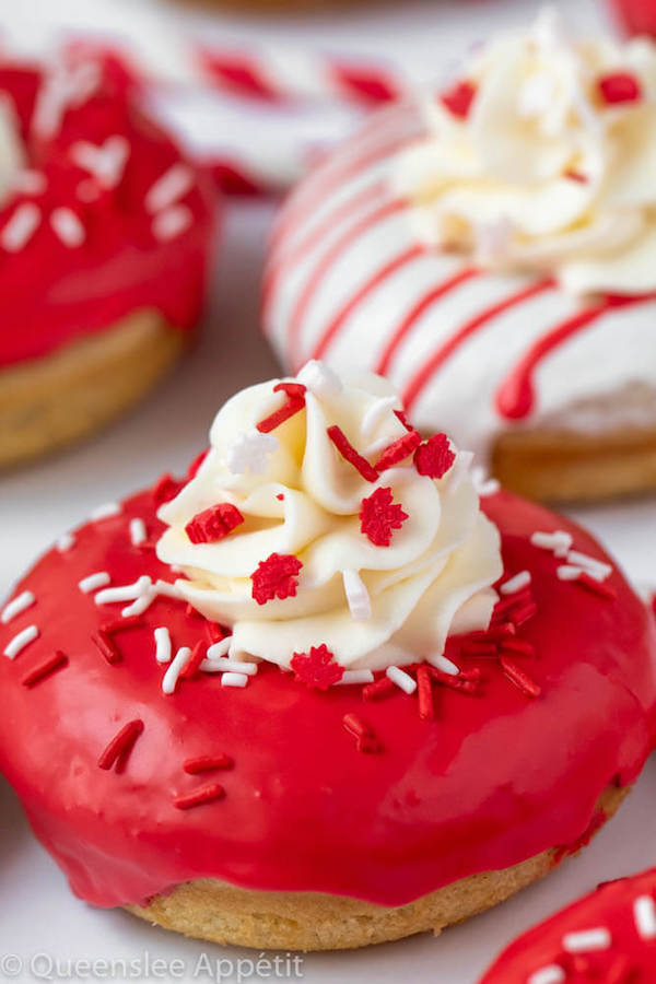 Red and White Vanilla Canada Day Donuts with whipped cream on top