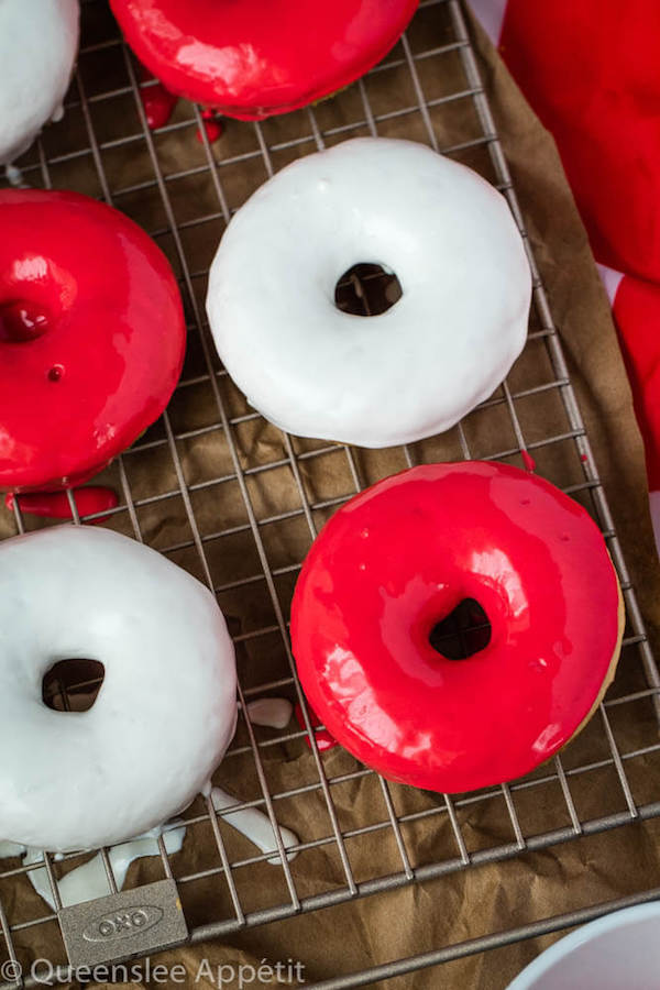 Moist and fluffy baked vanilla donuts dipped in red and white glaze