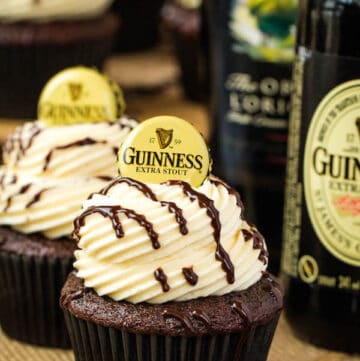 Guinness Chocolate Cupcakes with Baileys Buttercream Frosting, Guinness ganache drizzle and beer bottle cap on top