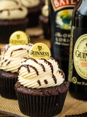 Guinness Chocolate Cupcakes with Baileys Buttercream Frosting, Guinness ganache drizzle and beer bottle cap on top