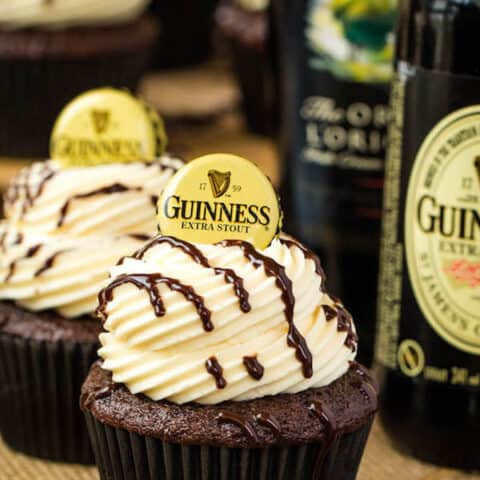 Guinness Chocolate Cupcakes with Baileys Buttercream Frosting, Guinness ganache drizzle and beer bottle cap on top