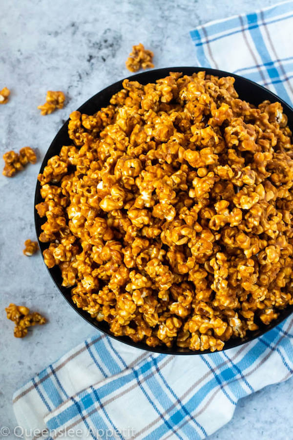 This Homemade Caramel Popcorn is made with a delicious homemade caramel sauce for a sweet, buttery, crunchy and fun snack that’s far better than the store-bought version! 