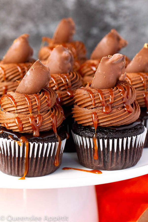 chocolate cupcakes with ganache, chocolate caramel cream cheese frosting, salted caramel and a turtle chocolate on top