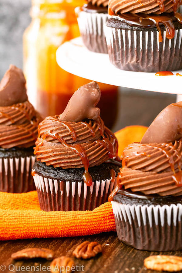 chocolate cupcakes with ganache, chocolate caramel cream cheese frosting, salted caramel and a turtle chocolate on top