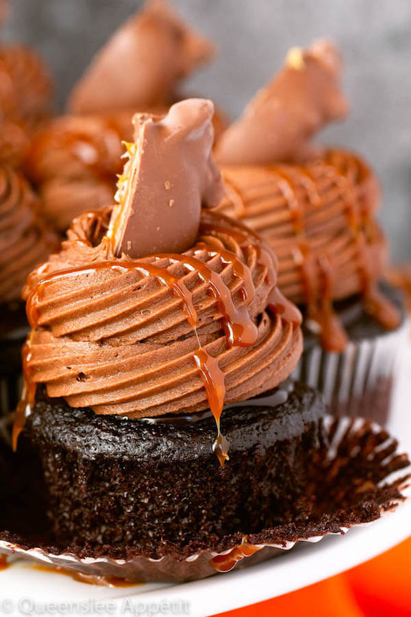 chocolate cupcakes with ganache, chocolate caramel cream cheese frosting, salted caramel and a turtle chocolate on top