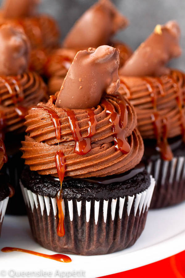 chocolate cupcakes with ganache, chocolate caramel cream cheese frosting, salted caramel and a turtle chocolate on top