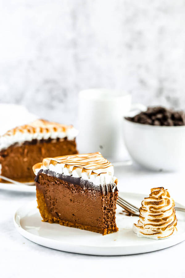 s'mores cheesecake - chocolate cheesecake baked in a graham cracker crust, topped with chocolate ganache and marshmallow meringue