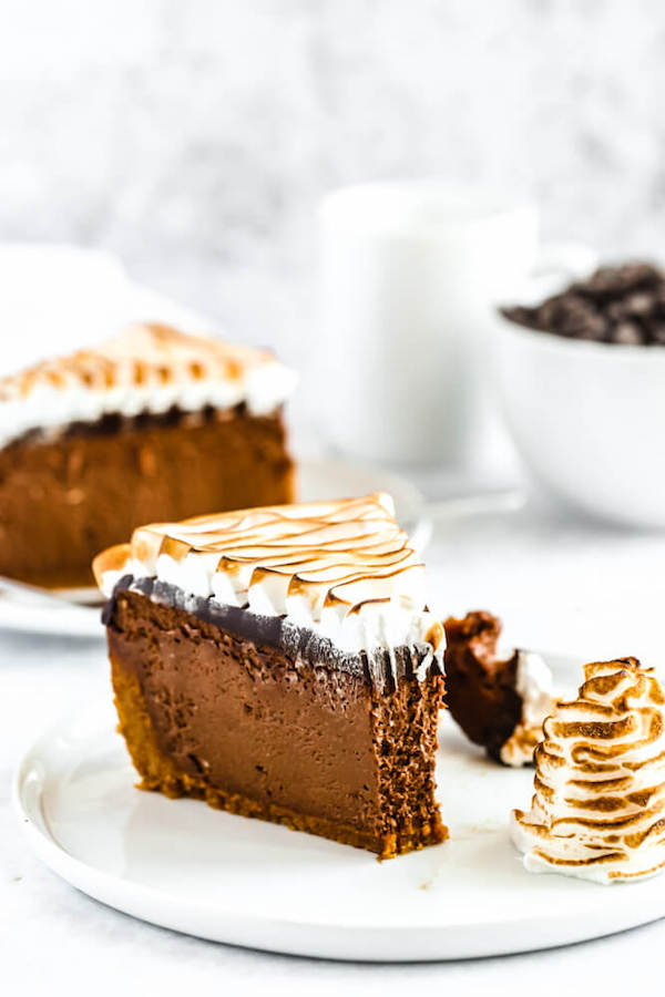 s'mores cheesecake - chocolate cheesecake baked in a graham cracker crust, topped with chocolate ganache and marshmallow meringue