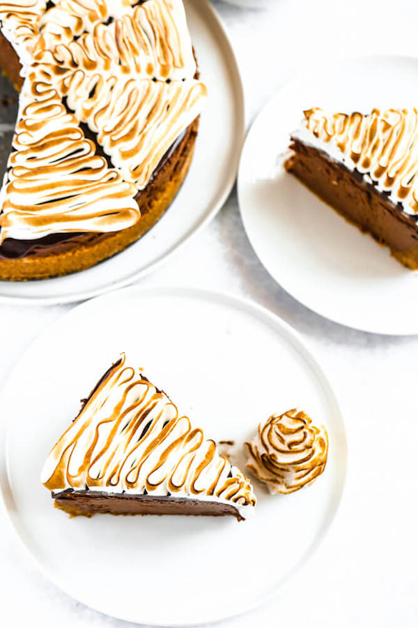 s'mores cheesecake - chocolate cheesecake baked in a graham cracker crust, topped with chocolate ganache and marshmallow meringue