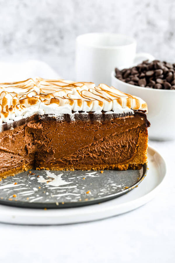 s'mores cheesecake - chocolate cheesecake baked in a graham cracker crust, topped with chocolate ganache and marshmallow meringue