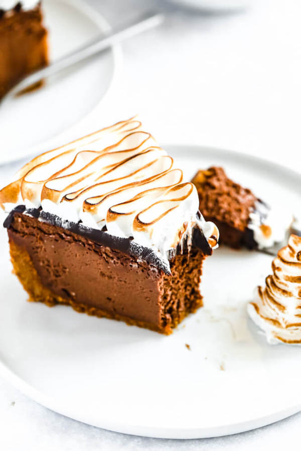 s'mores cheesecake - chocolate cheesecake baked in a graham cracker crust, topped with chocolate ganache and marshmallow meringue