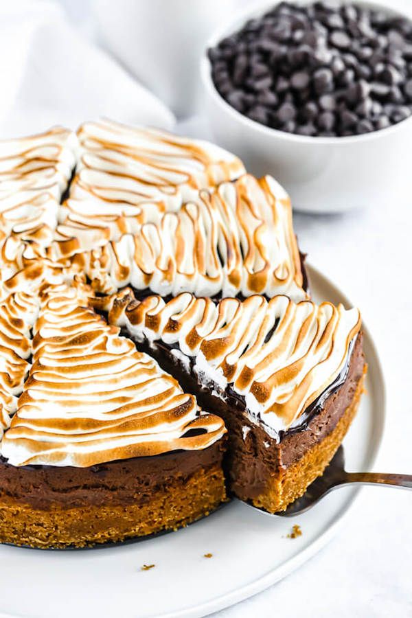 s'mores cheesecake - chocolate cheesecake baked in a graham cracker crust, topped with chocolate ganache and marshmallow meringue