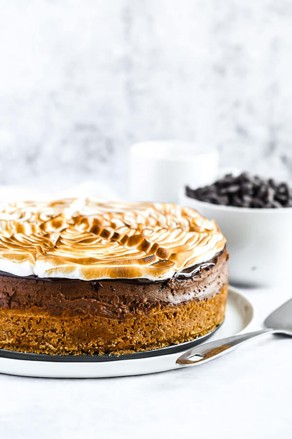 s'mores cheesecake - chocolate cheesecake baked in a graham cracker crust, topped with chocolate ganache and marshmallow meringue