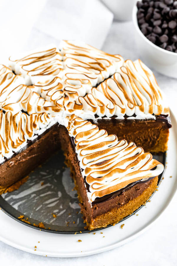 s'mores cheesecake - chocolate cheesecake baked in a graham cracker crust, topped with chocolate ganache and marshmallow meringue