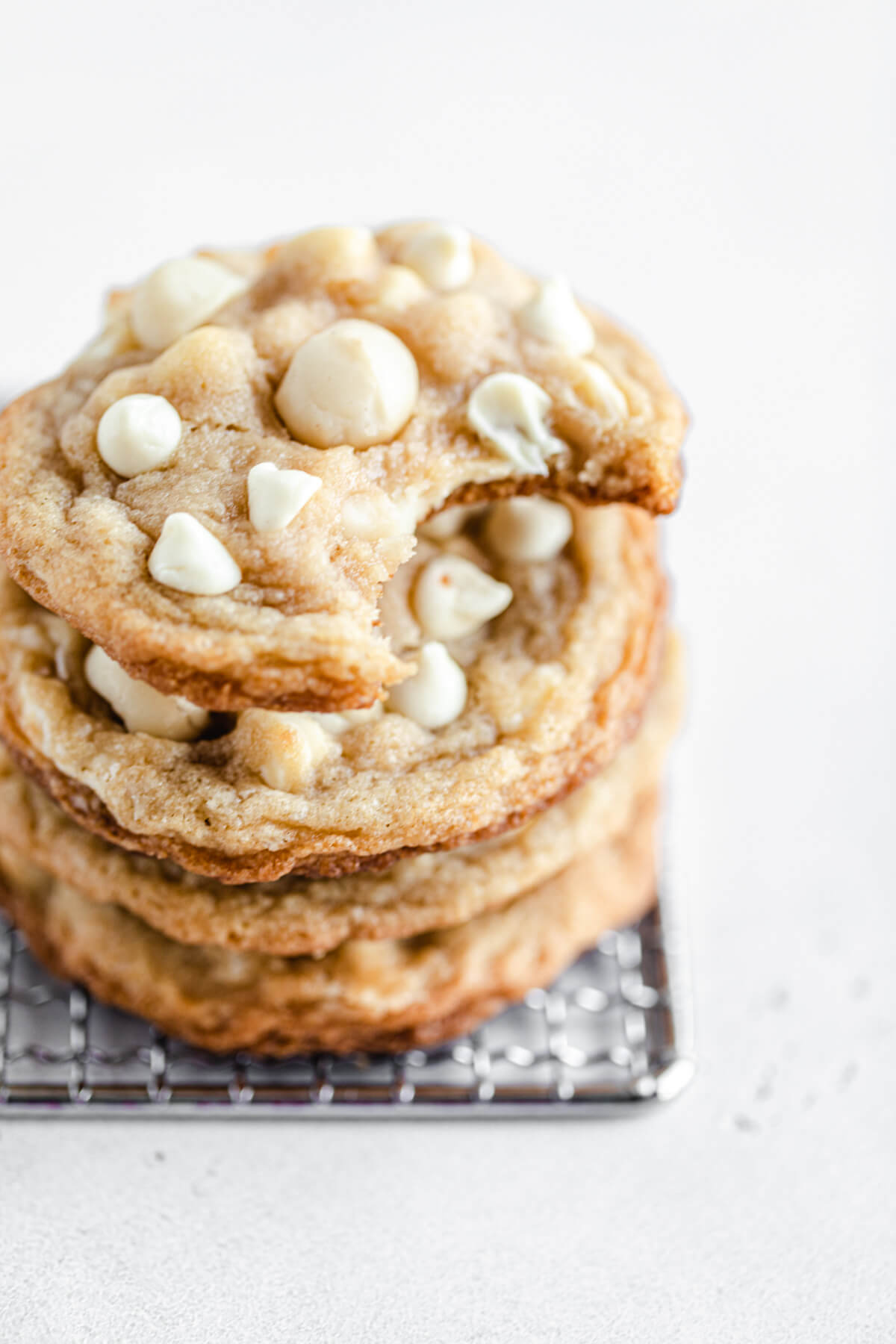 stack of cookies with a bite taken out of the top one