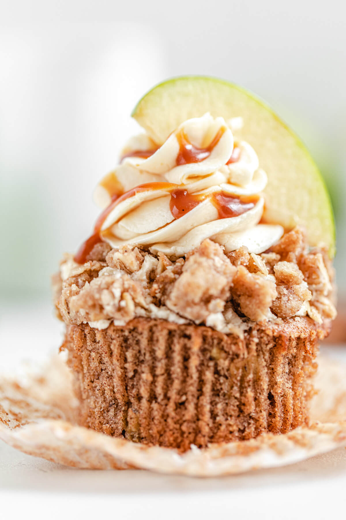 close up of unwrapped apple crumble cupcake