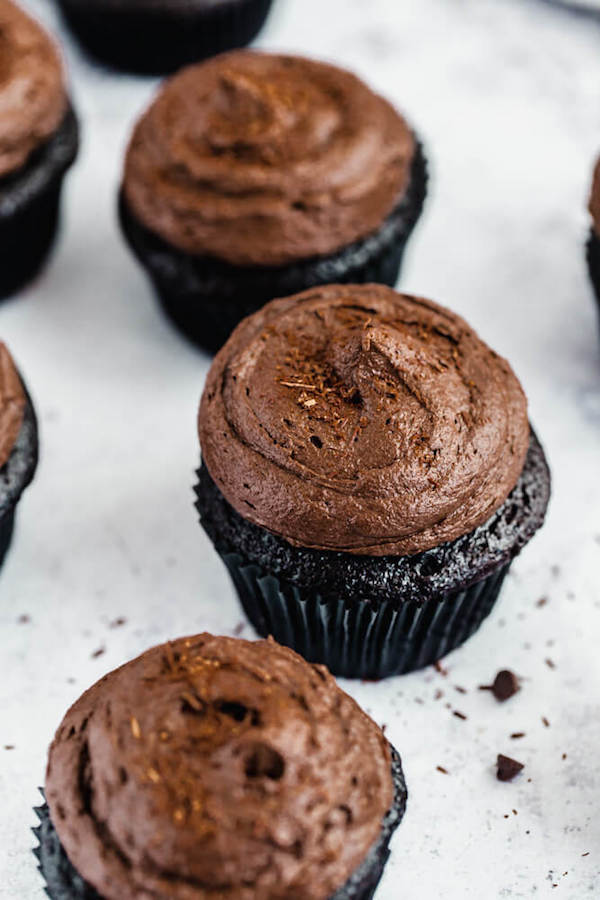 dark chocolate cupcakes topped with dark chocolate ganache frosting