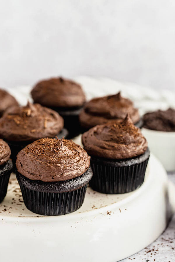 dark chocolate cupcakes topped with dark chocolate ganache frosting