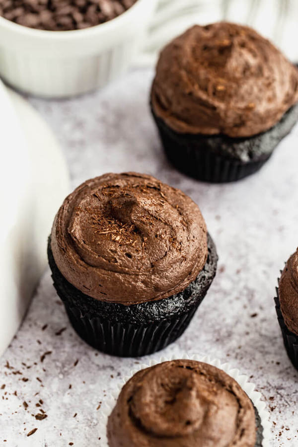 dark chocolate cupcakes topped with dark chocolate ganache frosting