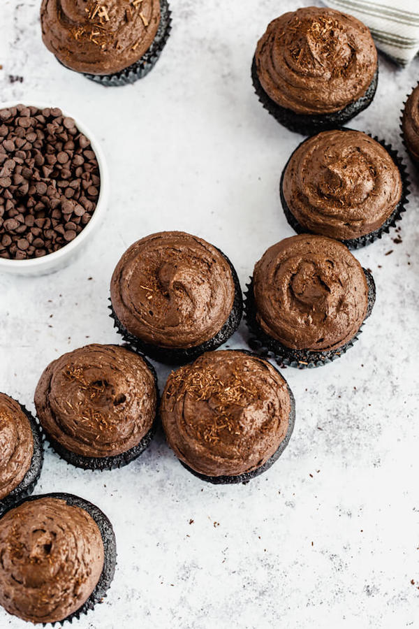 dark chocolate cupcakes topped with dark chocolate ganache frosting