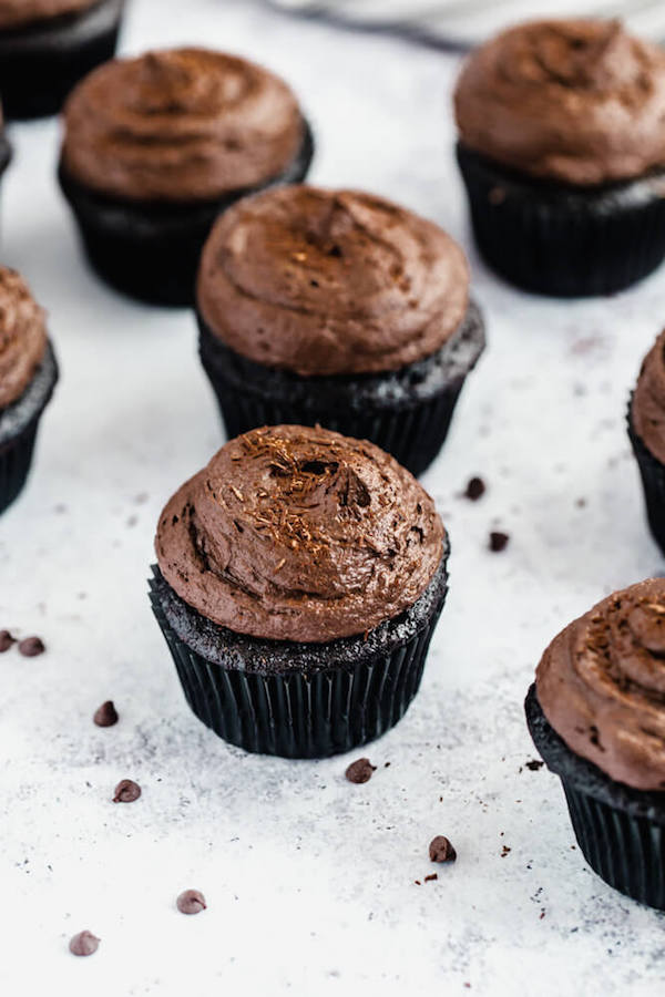 dark chocolate cupcakes topped with dark chocolate ganache frosting