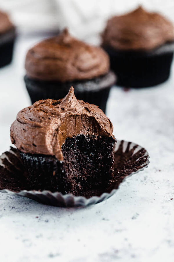 dark chocolate cupcakes topped with dark chocolate ganache frosting