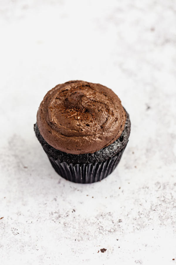 dark chocolate cupcakes topped with dark chocolate ganache frosting