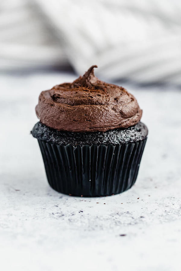 dark chocolate cupcakes topped with dark chocolate ganache frosting