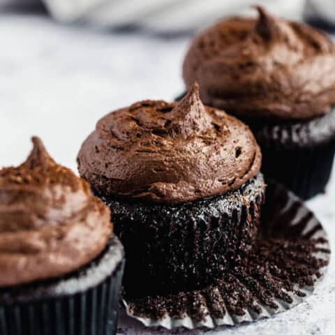 dark chocolate cupcakes topped with dark chocolate ganache frosting