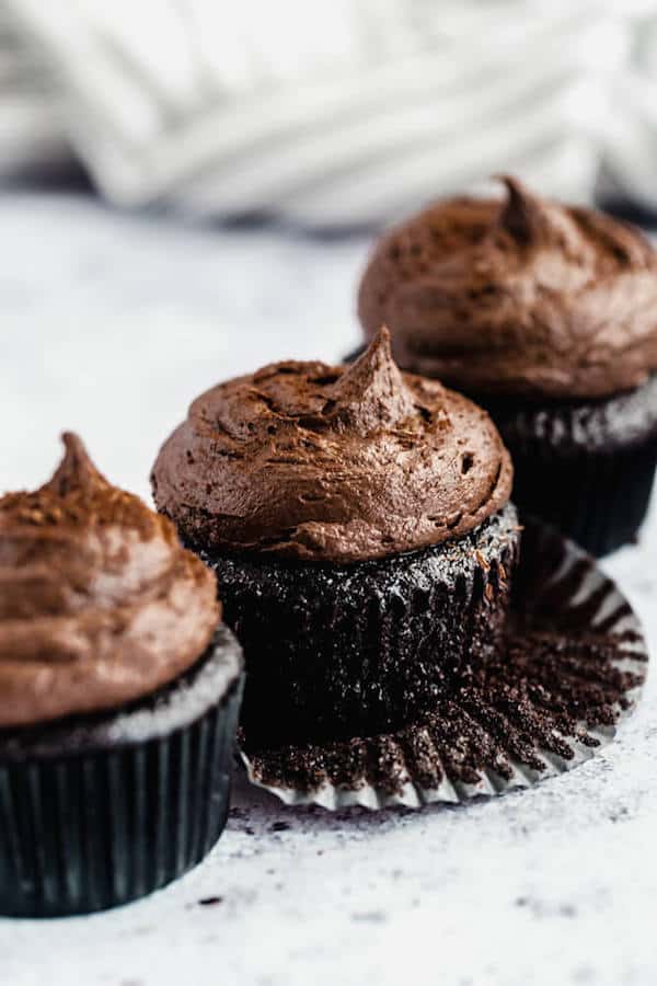 dark chocolate cupcakes topped with dark chocolate ganache frosting