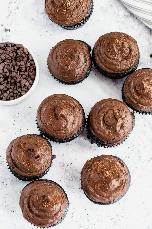 dark chocolate cupcakes topped with dark chocolate ganache frosting