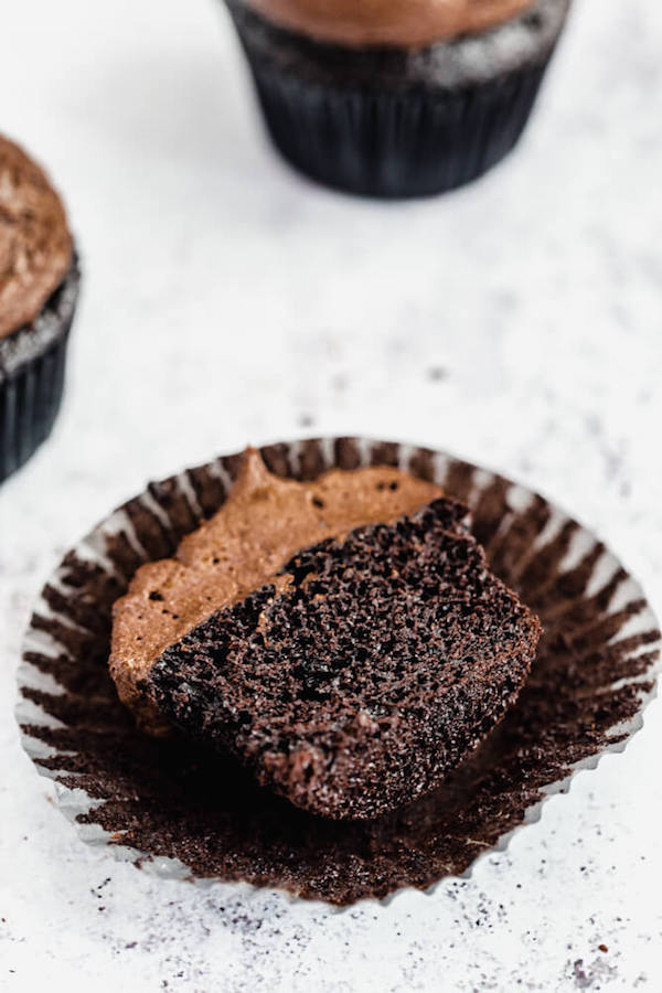 dark chocolate cupcakes topped with dark chocolate ganache frosting