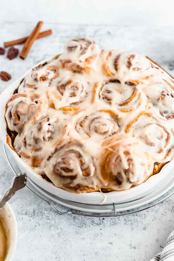 pumpkin cinnamon rolls topped with browned butter cream cheese icing