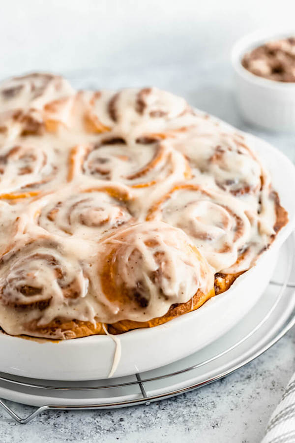 pumpkin cinnamon rolls topped with browned butter cream cheese icing